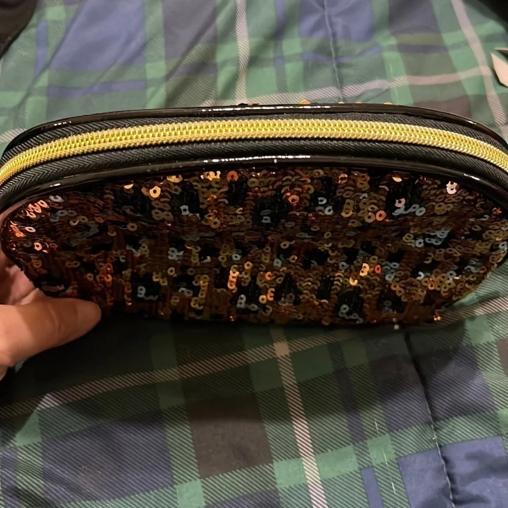 Betsey Johnston gold and black sequined  cosmetic bag. Good condition